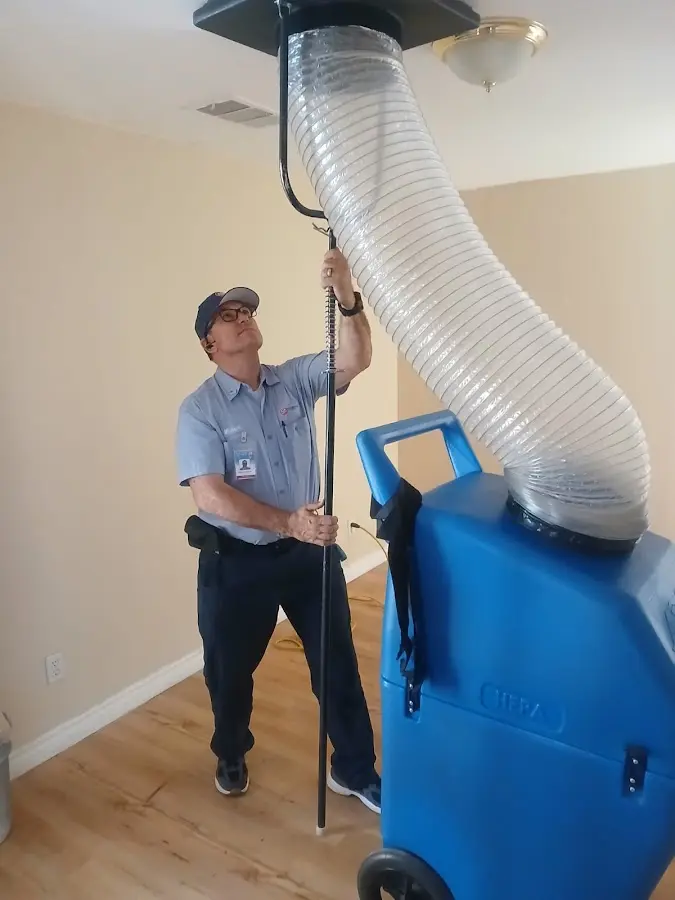 Furnace Tune-Up technician using HEPA equipment in Flossmoor